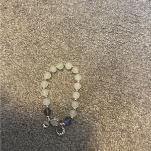 White and gray bracelet with charms